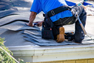 Man repairs Cartersville, GA roof.